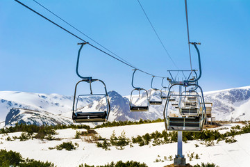 Fototapeta na wymiar Cableway Gondola in the Winter Mountains in Bulgaria 