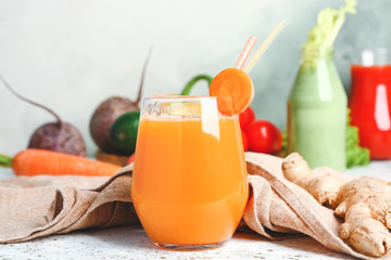 Glass of fresh vegetable juice on table