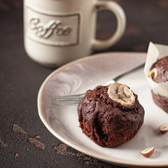 Tasty homemade chocolate muffin with banana. Chocolate cake with coffee.