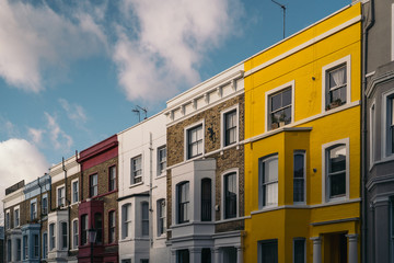 Fototapeta na wymiar Several colorful houses off of Portobello Road in London, England. Notting Hill neighborhood