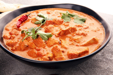 Chicken tikka masala spicy curry meat food in pot with rice and naan bread. indian food