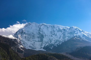 Fototapeta na wymiar Nepal snowy mountains against the blue sky with clouds