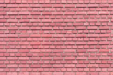 Wall of small red-pink brick. Smooth brickwork. Background for sites and layouts.