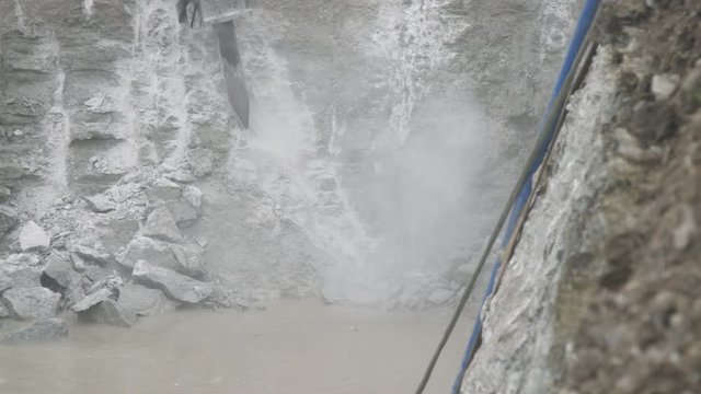 Breaking limestone rock using hydraulic breaker