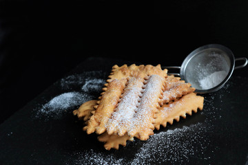 typical italian carnival pasty sprinkled with powdered sugar