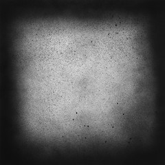 Vintage black and white speckle texture. Abstract splattered background for vignette. Square frame template