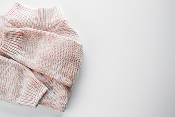 Warm knitted sweater with a pattern. Isolate on white.