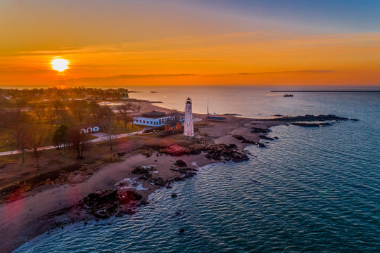 5 Mile Point Lighthouse and Oyster Boat at Sunrise