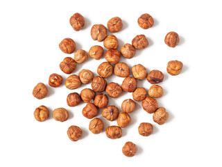 Handful of peeled hazelnuts on a white background