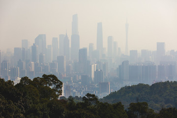 Fototapeta premium View of Guangzhou city with Zhujiang New Town from White Cloud Mountain, Baiyun Mountain, Guandong, China, sunny summer day