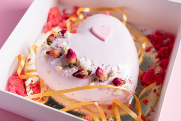 Cake with strawbery in the shape of heart on Valentine's Day