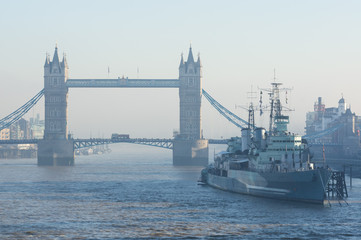 Obraz premium Tower Bridge and HMS Belfast on a foggy day, London, England