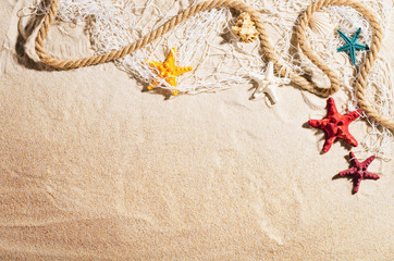 Fototapeta na wymiar Background with sandy beach, top view. Summer accessories concept