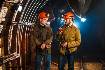 Two miners in the mine