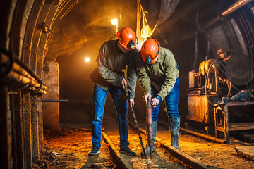 Two miners in the mine