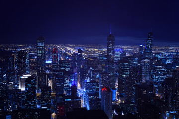 Fototapeta na wymiar Busy night skyline panorama of Chicago city downtown skyscrapers and streets, Illinois USA.