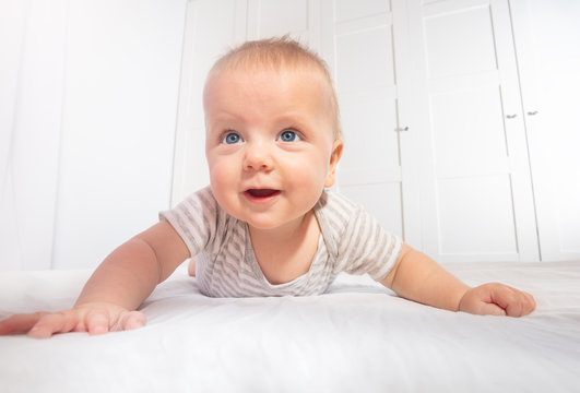 Cute Little Baby Boy Toddler Learn To Crawl View From Low Angle Smiling To Camera