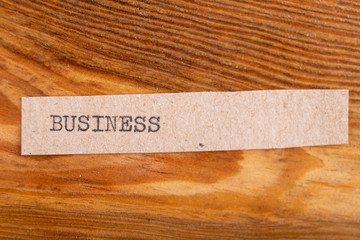 The word "business" typed. The inscription on a gray sheet of pappier.