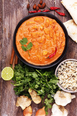 Chicken tikka masala spicy curry meat food in pot with rice and naan bread. indian food