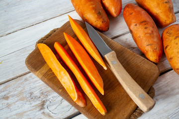 sweet potato on white wooden surface