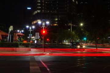 Red lights in motion during a night in the city