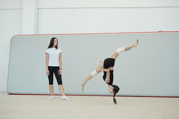 Jumping over head at training