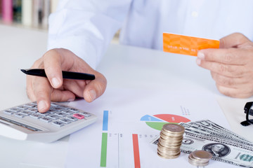hand with calculator and money