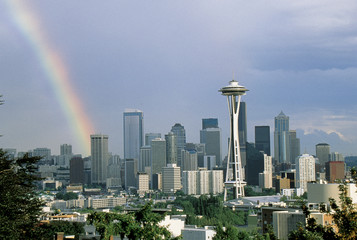 This is the skyline with the Space Needle and a rainbow. It is the view from Queen Ann Hill.