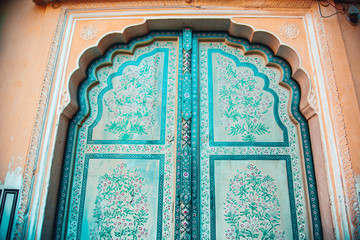 Green door of palace building in India