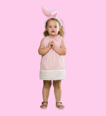 Lovely blonde toddler wearing easter bunny ears