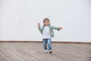 Happy boy runs around the stage. Blurred image - 316641270