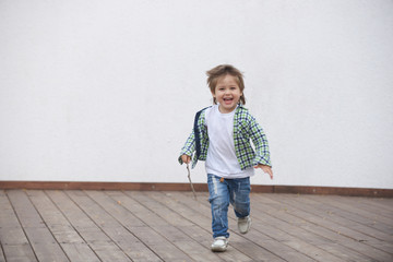 Happy boy runs around the stage. Blurred image - 316641406