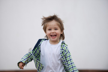 Happy boy runs around the stage. Blurred image - 316641424