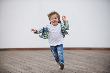 Happy boy runs around the stage. Blurred image - 316641465