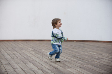 Happy boy runs around the stage. Blurred image - 316641498