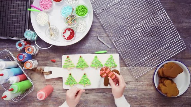 Flat lay. Step by step. Decorating gingerbread and sugar cookies with royal icing for Christmas.