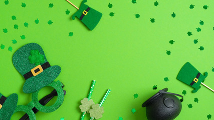 Irish Saint Patrick's day concept. Patricks day frame of leprechaun hats, drinking straws with...