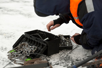 Portrait of a worker repairing equipment in extreme conditions