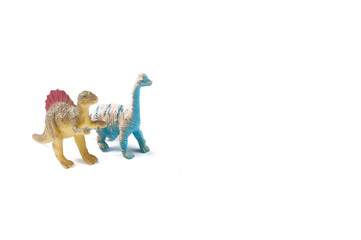 Toy dinosaurs isolated on white background.Copy space