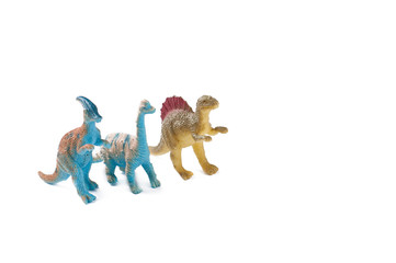 Toy dinosaurs isolated on white background.Copy space