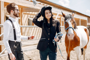 Horse theme. Businessman with a horse. Brunette with her friend