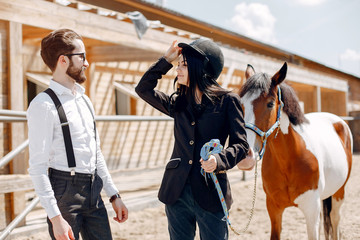 Horse theme. Businessman with a horse. Brunette with her friend