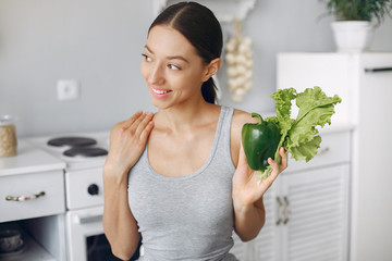 Healthy eating. Dieting and people concept. Brunette with a vegetable.