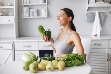 Healthy eating. Dieting and people concept. Brunette with a vegetable.