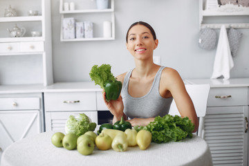 Healthy eating. Dieting and people concept. Brunette with a vegetable.