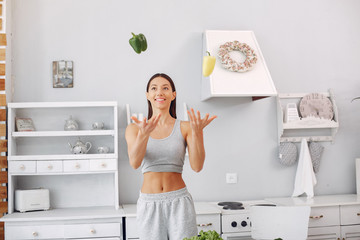 Healthy eating. Dieting and people concept. Brunette with a vegetable.