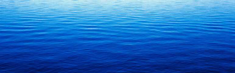 Naklejka premium These are water reflections in Lake Tahoe. The water is a deep blue and the small ripples in the water form a pattern.