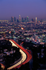 Fototapeta na wymiar This shows the Hollywood Freeway and skyline at dusk. It is the view from Mulholland Drive.