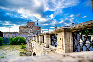 Castel Sant'Angelo and the St. Angelo Bridge located on the Tiber River in Rome, Italy.