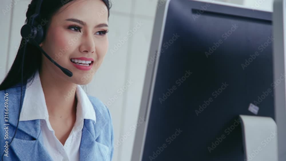Aufkleber customer support agent or call center with headset works on desktop computer while supporting the cu
